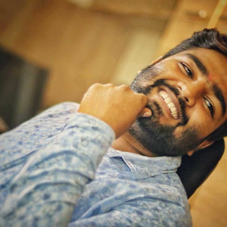 Kaveri Mehta, Lead Design Curator at FreshGardenPivot, reviewing corporate floral arrangements